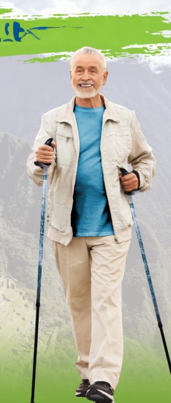 Senior man walking with walking poles against a gray/green colored background