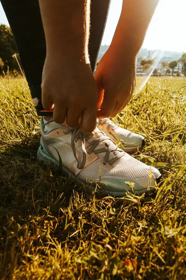 Closeup of person tying their shoes