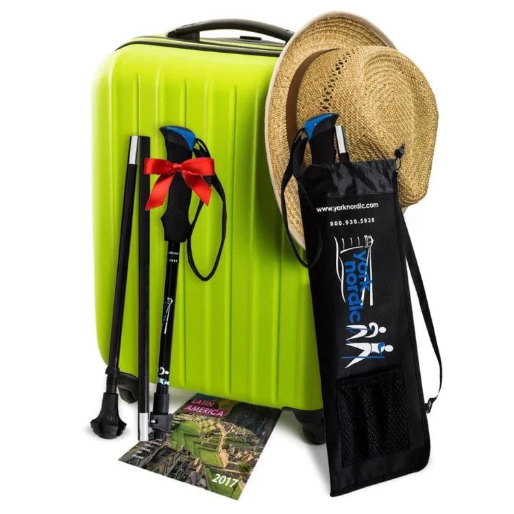 York Nordic Folding Travel Poles and Carry Bag Next to a Suitcase