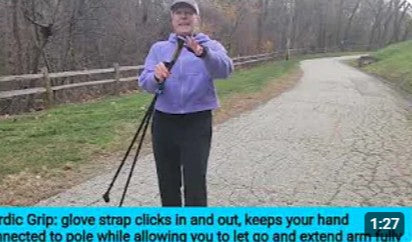 Woman holding walking poles