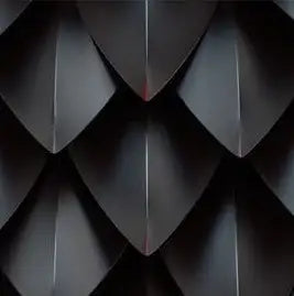 Black diamond-shaped patterned wall art with metallic sheen.